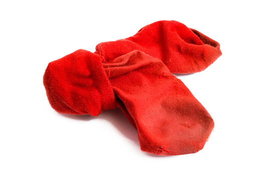 Dirty red socks isolated on a white background