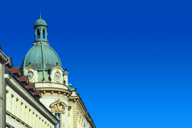 istock Ancient clock tower on a building in Prague, Czech Republic. Praha, old clock tower on a blue sky background 1307899375