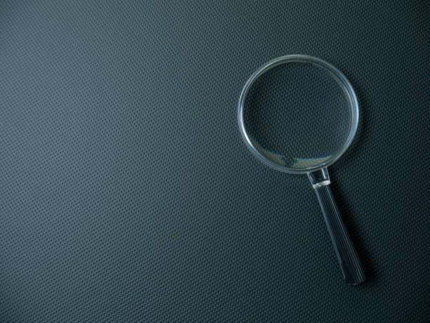 istock The Magnifying glass on black background for search concept 1307900333