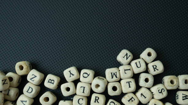 istock The alphabet wood cube on black background  for  education concept 1307900528
