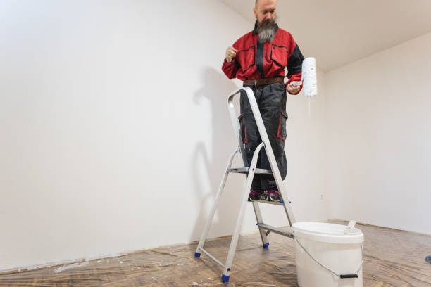 istock Home improvement, man painting walls 1307904238