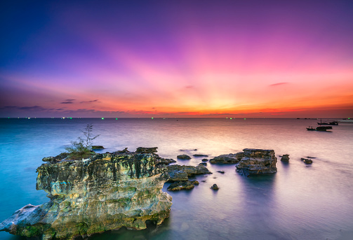 Colorful sunset in Phu Quoc Island, Vietnam moments of transition between day and night sunlight to create warm colors and rays light. Travel destination of discovery