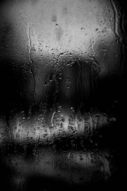 istock water drops on glass surface, abstract textured water splashes 1307909720