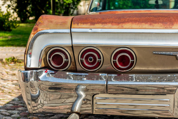 Tail lights of a weathered classic american car from the sixties stock photo