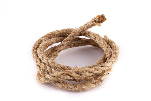 Coiled sisal rope on a white isolated background