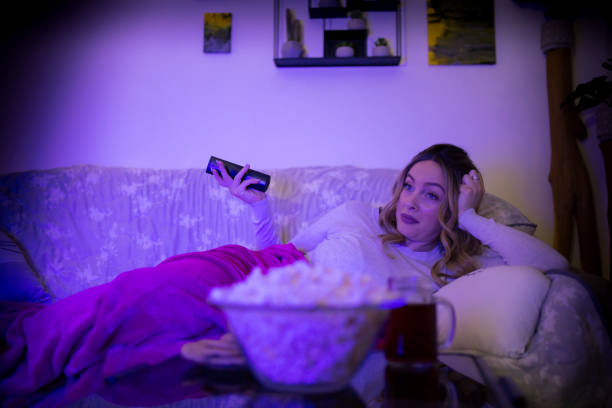 istock Woman watching TV 1307914558