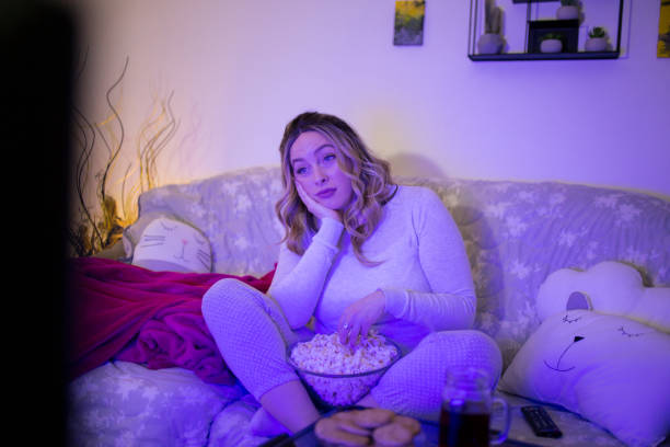istock Woman watching sad movie 1307914853
