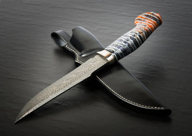 istock Hunting knife handmade on a black background. Leather Sheath Handmade 1307915866
