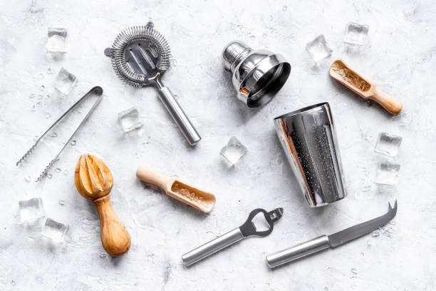 istock Cocktail bar utensils and tools with shaker, strainer and ice 1307916129