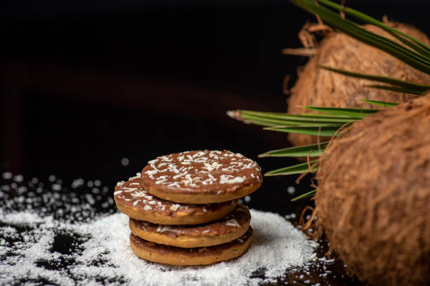 istock Coconut cookies with open dried coconut and palm leaves 1307917042