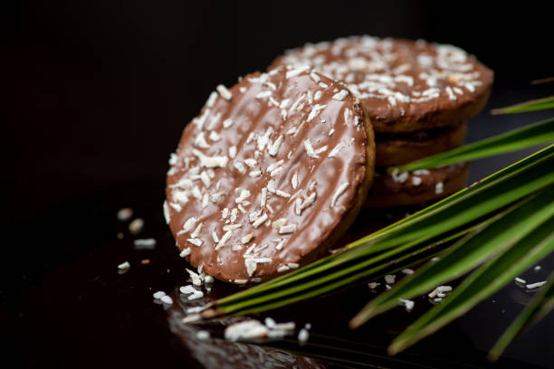 istock Coconut cookies with open dried coconut and palm leaves 1307917068