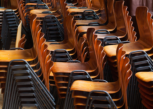 Many stacked chairs