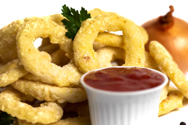 istock Crispy fried onion rings snacks with ketchup 1307917511