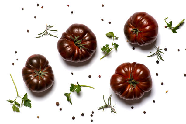 Fresh dark red raw tomato called primora isolated on white background flat lay top view