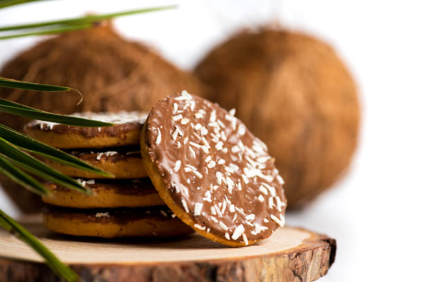 Coconut cookies with open dried coconut and palm leaves