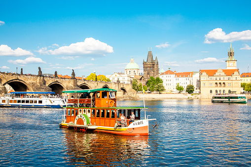 Prague, Czech Republic - May 11, 2021: City view and Vltava river boat cruise