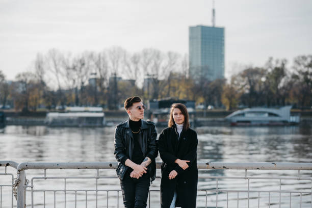 istock Young couple standing by the river 1307922124