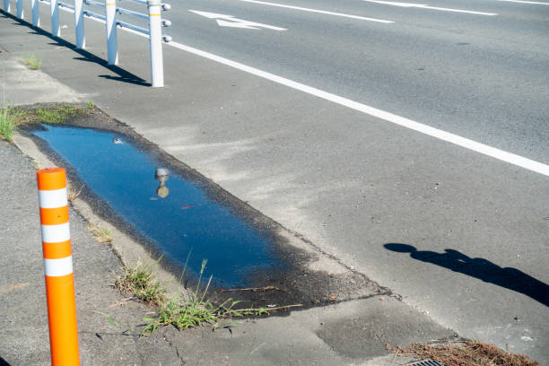 istock Photograph of a traffic cone installed on the sidewalk 1307922516