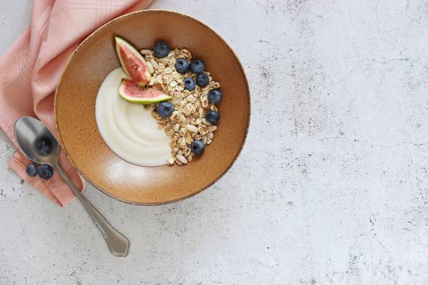 istock Muesli cereal mix with yogurt, fig and blueberries. 1307925536