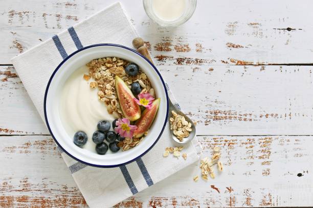 istock Muesli cereal mix with yogurt, fig and blueberries. 1307925610