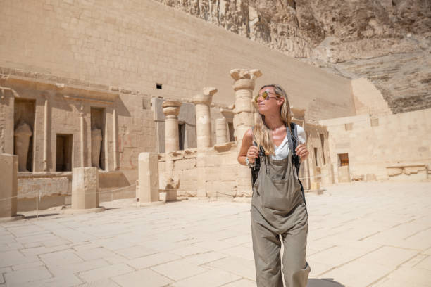 istock Woman explores ancient temples in Egypt 1307926754