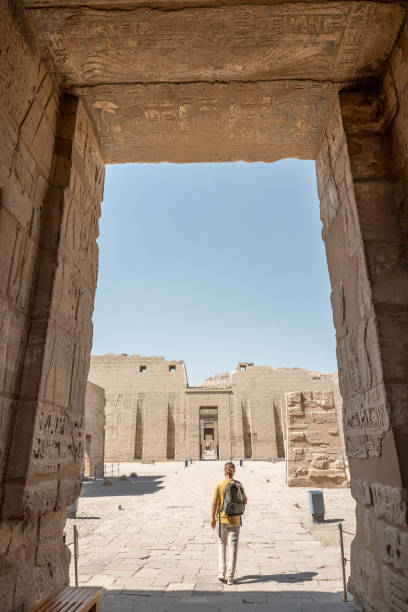istock Man wonders inside an ancient temple in Egypt 1307926784