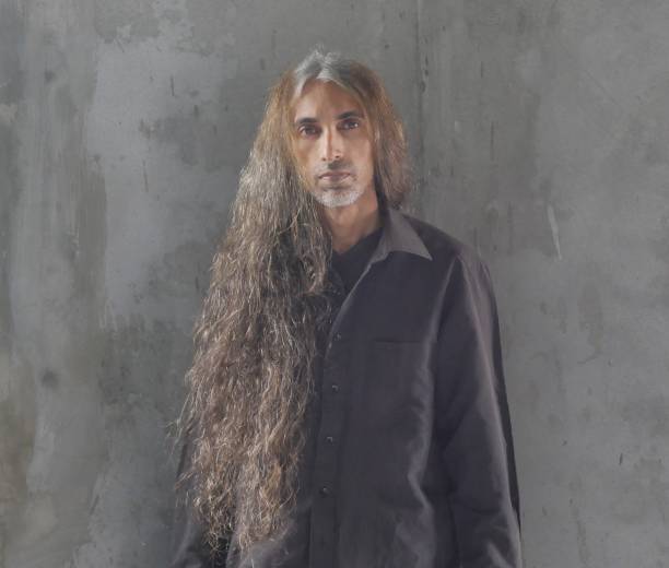 istock Middle Eastern man with long hair and white beard posing 1307927764