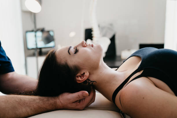 istock Physiotherapist practicing chiropractic techniques on a young adult woman patient 1307928165