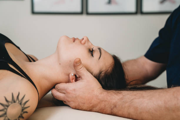 istock Physiotherapist practicing chiropractic techniques on a young adult woman patient 1307928183