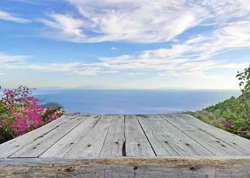 Wooden table top on blue sea