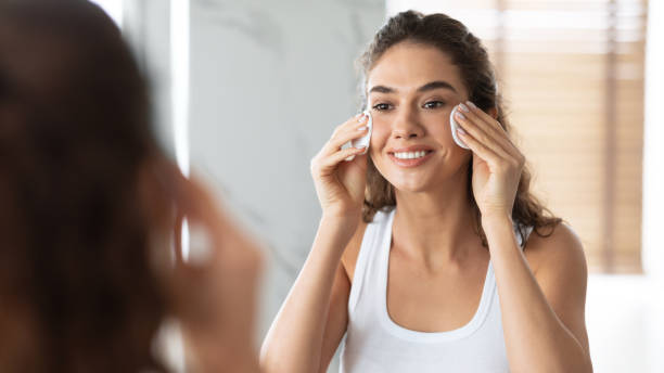 istock Woman Using Cotton Pads Caring For Face Skin In Bathroom 1307929231