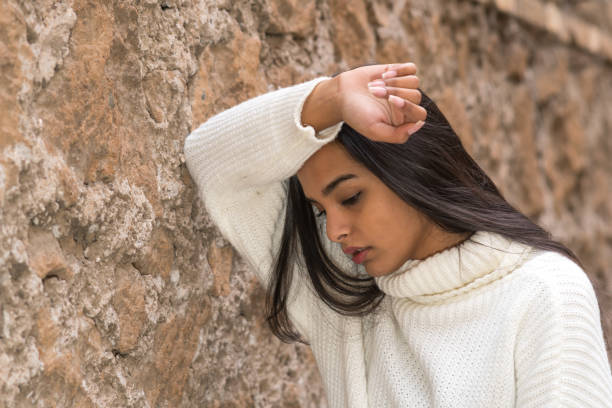 istock Tired and nostalgic young woman 1307929411