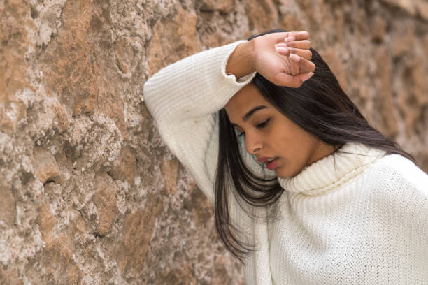 istock Tired and nostalgic young woman 1307929437