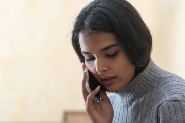 istock Young woman at phone 1307929671