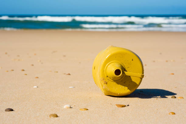 istock plastic canister close-up on the beach 1307930352