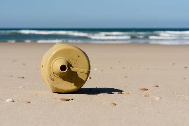 istock plastic canister close-up on the beach 1307930391