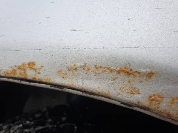 istock rust on the car body, metal corrosion. 1307930723