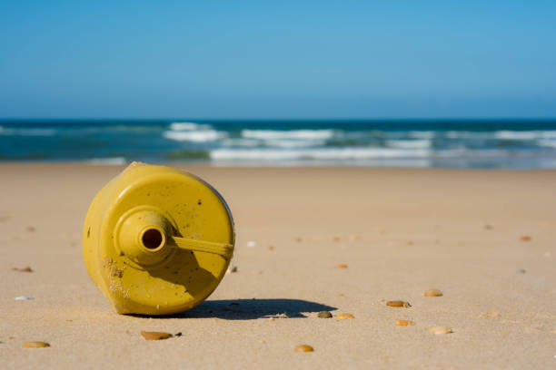 istock plastic canister close-up on the beach 1307930759