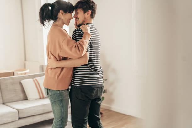 istock Couple dancing at home 1307932008