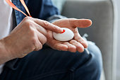 Closeup Of Man's Hand Pressing Alarm Button For Emergency