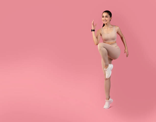 Photo of a Woman performing a Standing Hip Flexor