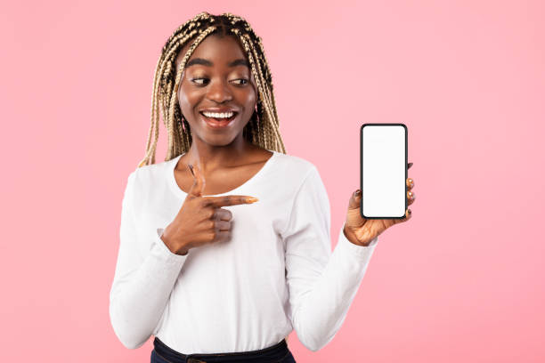istock Black lady showing blank empty cellphone screen for mockup 1307933274