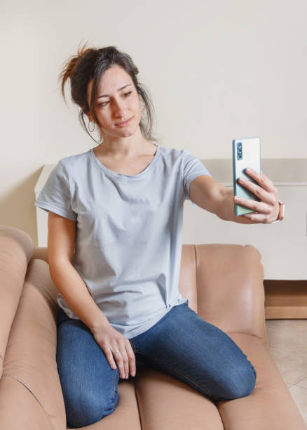 istock Young women taking selfie with cell phone 1307933364