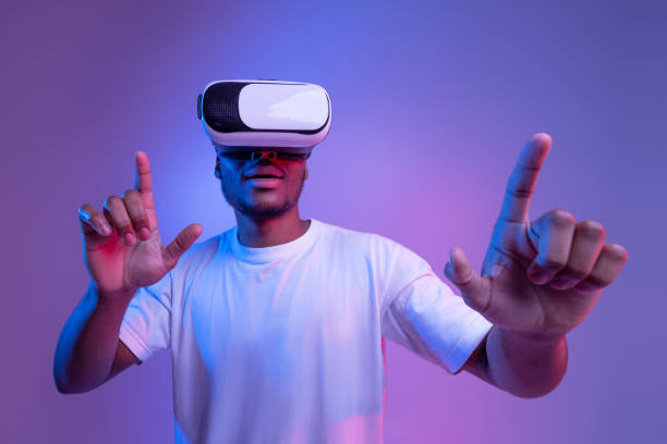 istock Gaming Technologies. Excited African American Guy In VR Glasses Under Neon Lighting 1307934894