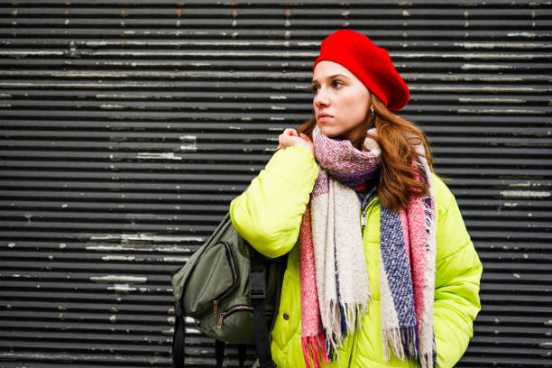 istock woman on a holiday wearing a backpack 1307935687