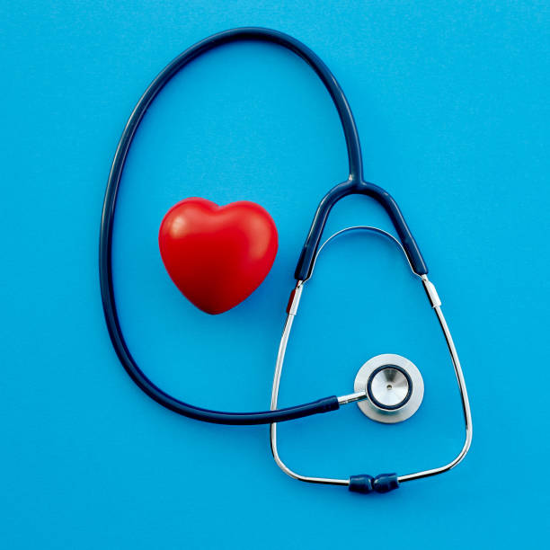 istock stethoscope and a red heart on a blue background 1307936122