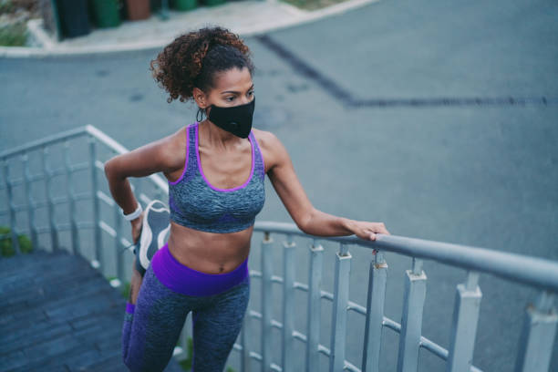 istock Woman stretching before jogging, COVID-19 pandemic 1307937284