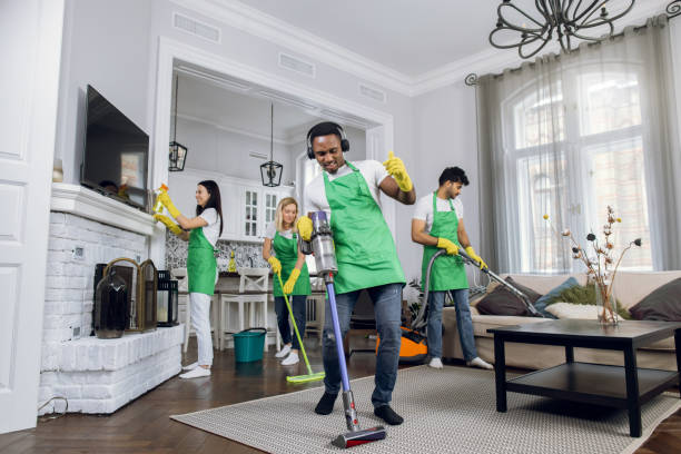 istock Team of cleaners listening music during working process 1307938759