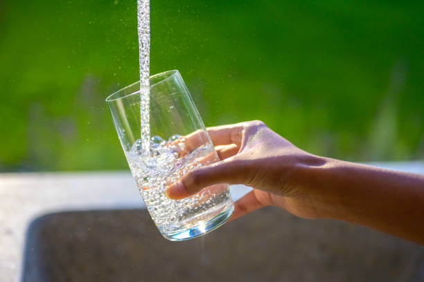 istock Filling glass with fresh water from tap 1307942781