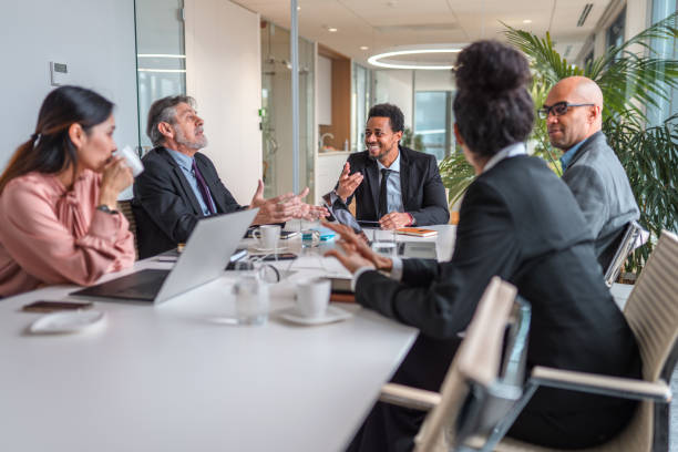 istock Business Colleagues In Board Room Having Fun During Meeting 1307943555